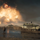 A tank from Battlefield 2042, in the mud, in front of a large explosion.